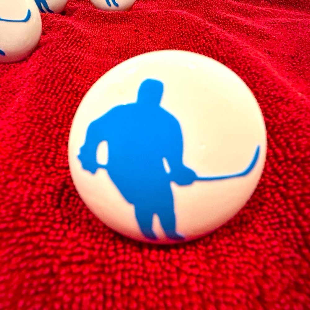 1.5 inch ceramic hockey player drawer pulls. Set of 8.